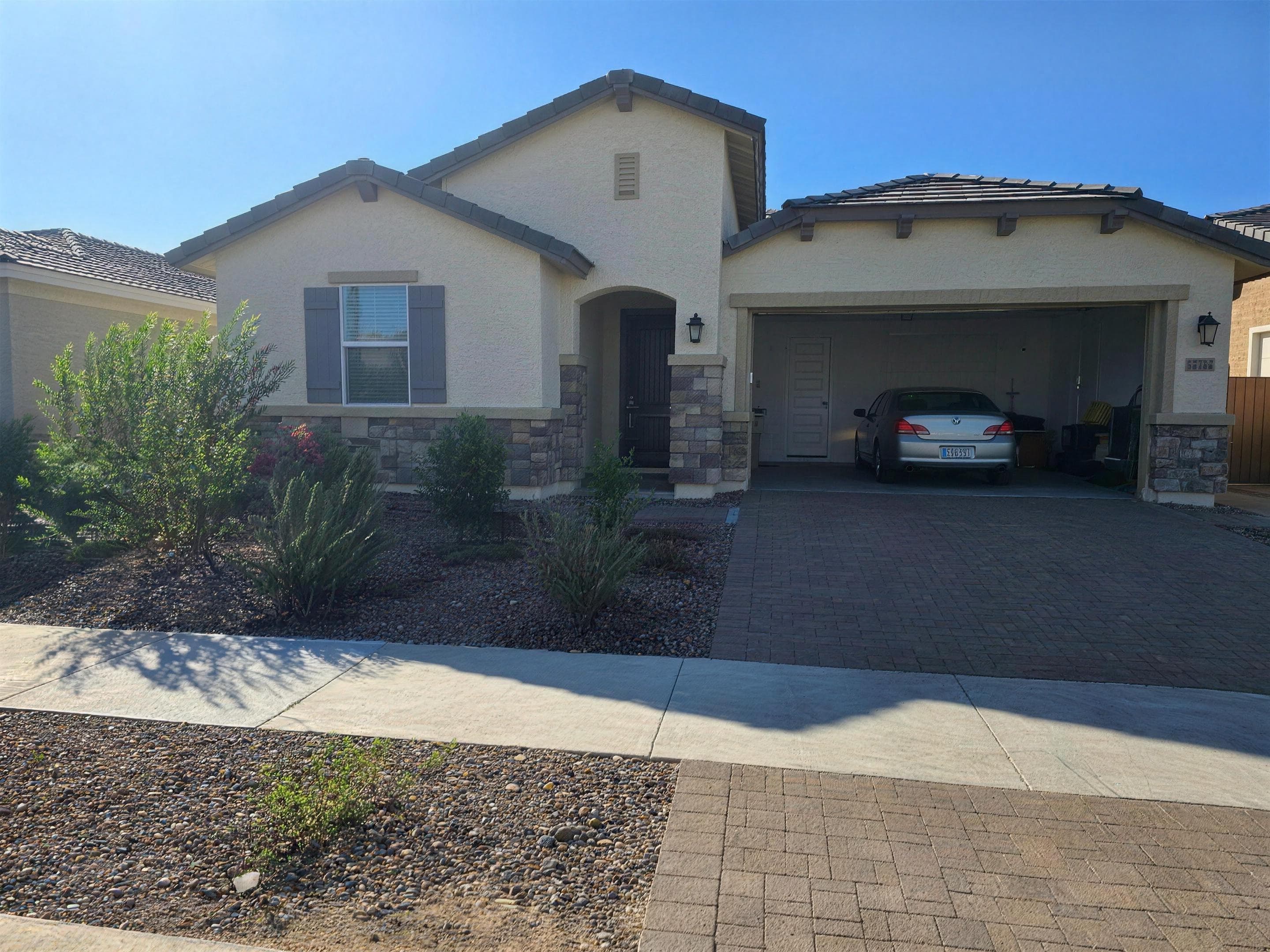 Front exterior of the 2024 new-build home with two-car garage