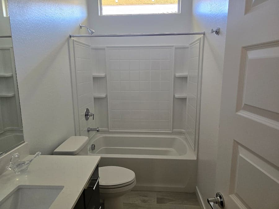 Full bathroom with tub and shower