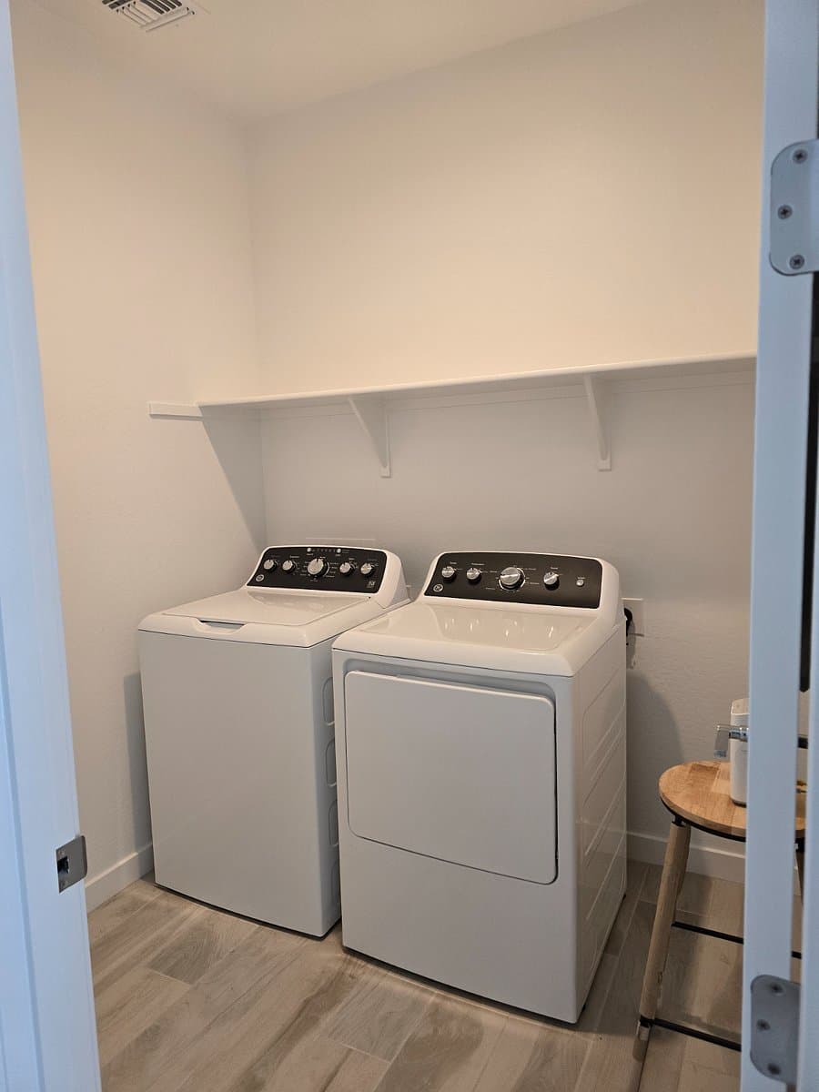 In-home laundry room with full-size washer and dryer