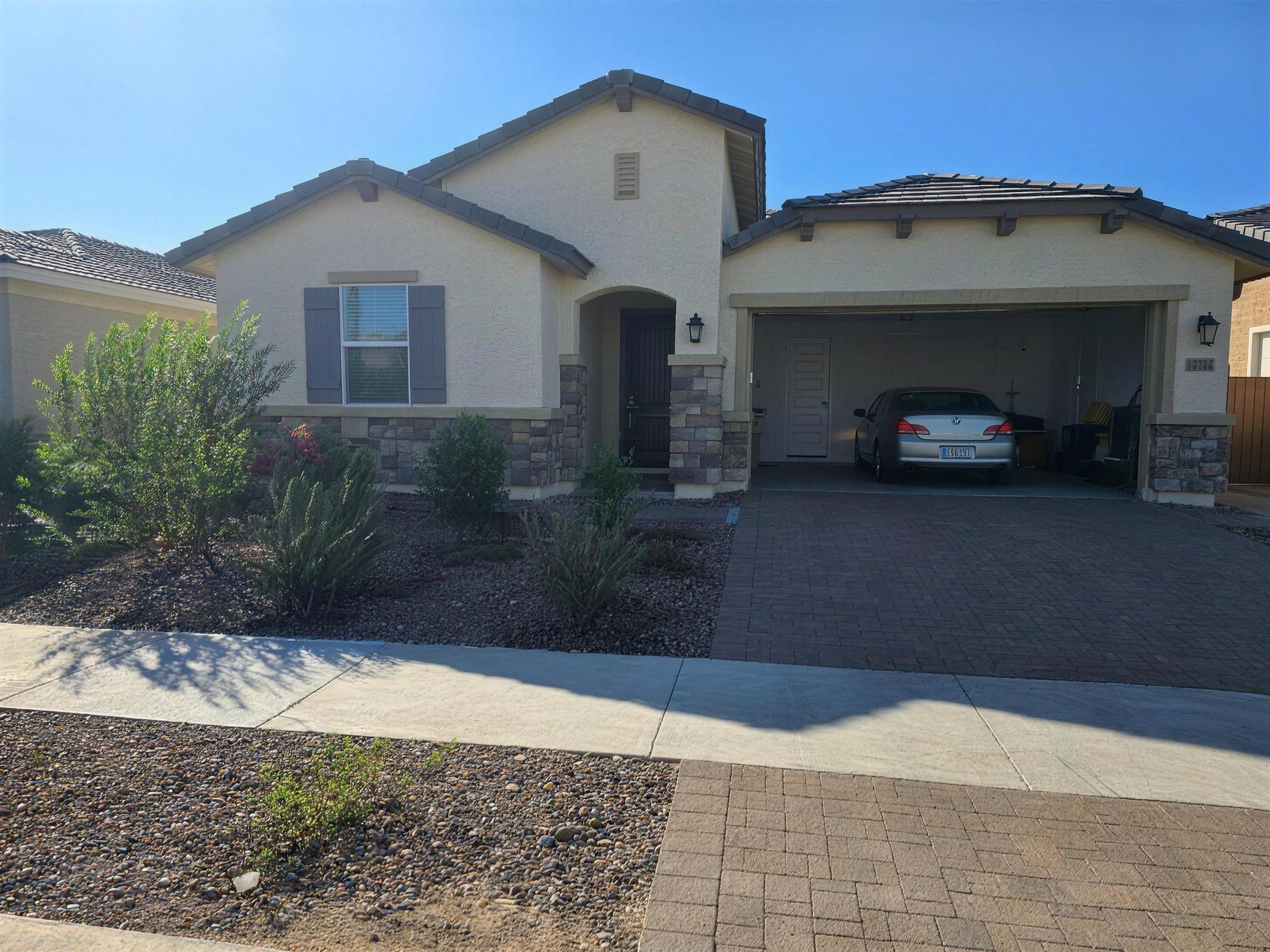 Front exterior of the 2024 new-build home with two-car garage